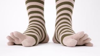 Person's feet wearing toe socks