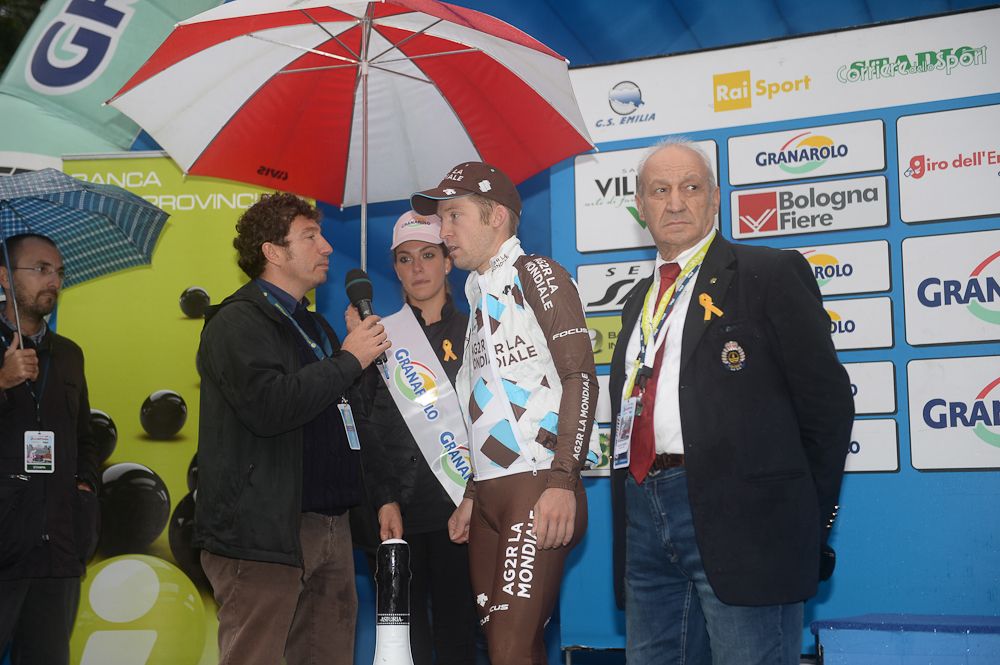 Jan Bakelants (AG2R La Mondiale) on a wet podium.
