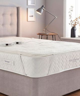 A Silentnight electric blanket on on mattress in bedroom