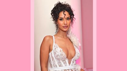 Maya Jama wears a white lace dress as she attends 'BOSS Loves Naomi', a special birthday event for Naomi Campbell, hosted by Daniel Grieder, on May 22, 2023 in Cannes, France. / in a pink template