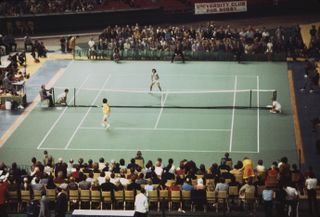 Tennis player Billie Jean King competes against retired pro Bobby Riggs (1918 - 1995) in the 'Battle of the Sexes' match at the Houston Astrodome in Texas on September 20th, 1973. King won in three straight sets.