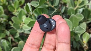 Our reviewer holding the Samsung Galaxy Buds 2 Pro right earbud
