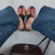 Shay in June wearing heeled flip-flops