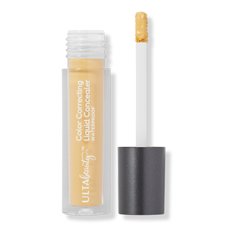 uncapped Color Correcting Liquid Concealer on a gray background
