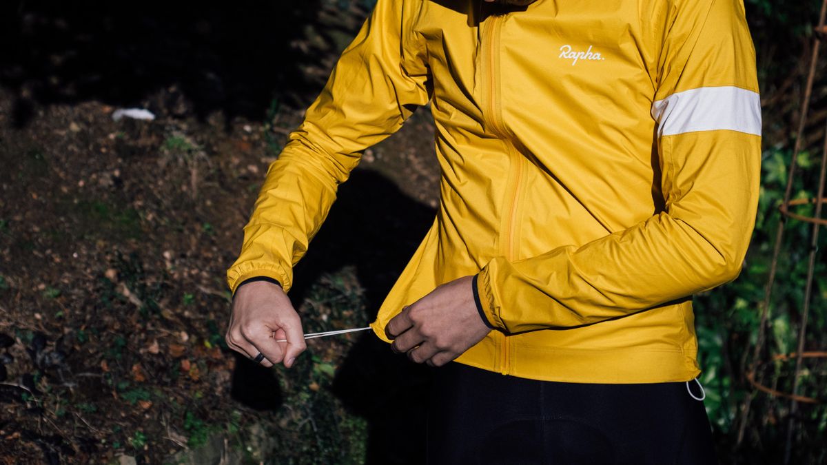 A yellow rapha core waterproof jacket