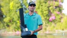 Joaquin Niemann holds a LIV Golf trophy
