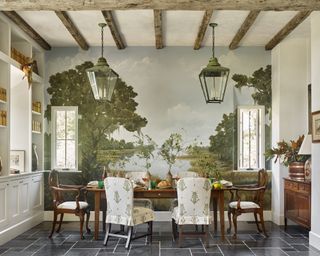 A dining room idea with large pastoral wall mural, traditional wooden dining chairs and Victorian lamps