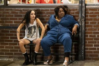 zoe kravitz and da'vine joy randolph sit on a. park bench in the high fidelity tv show