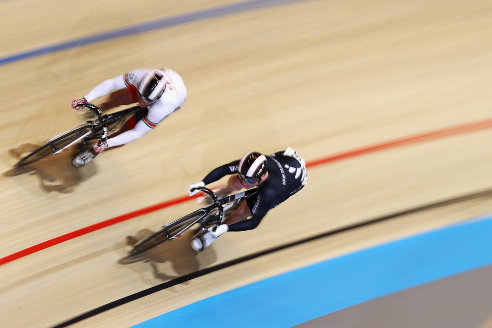 Jack Carlin of Great Britain and Zac Williams (black) of New Zealand compete in the Men's Sprint 1/16 Finals