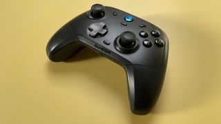 The GameSir T4 Cyclone Pro game controller for iOS and macOS against a yellow background.