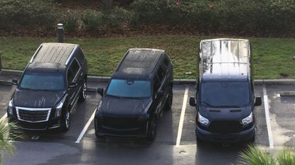 SUVs in parking spaces