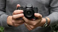 The Canon PowerShot G1 X Mark III being held in two hands