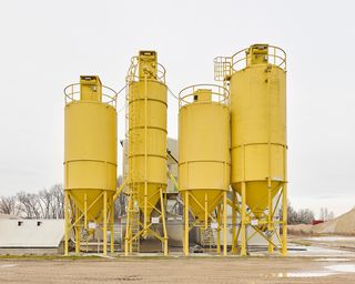 Photograph of yellow silos by Ákos Major