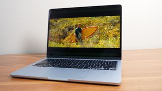 Apple MacBook Air 13-inch M4 showing a movie trailer on the display.