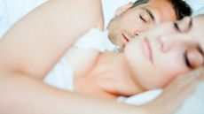 Can dehumidifiers help with snoring? Image shows couple in bed