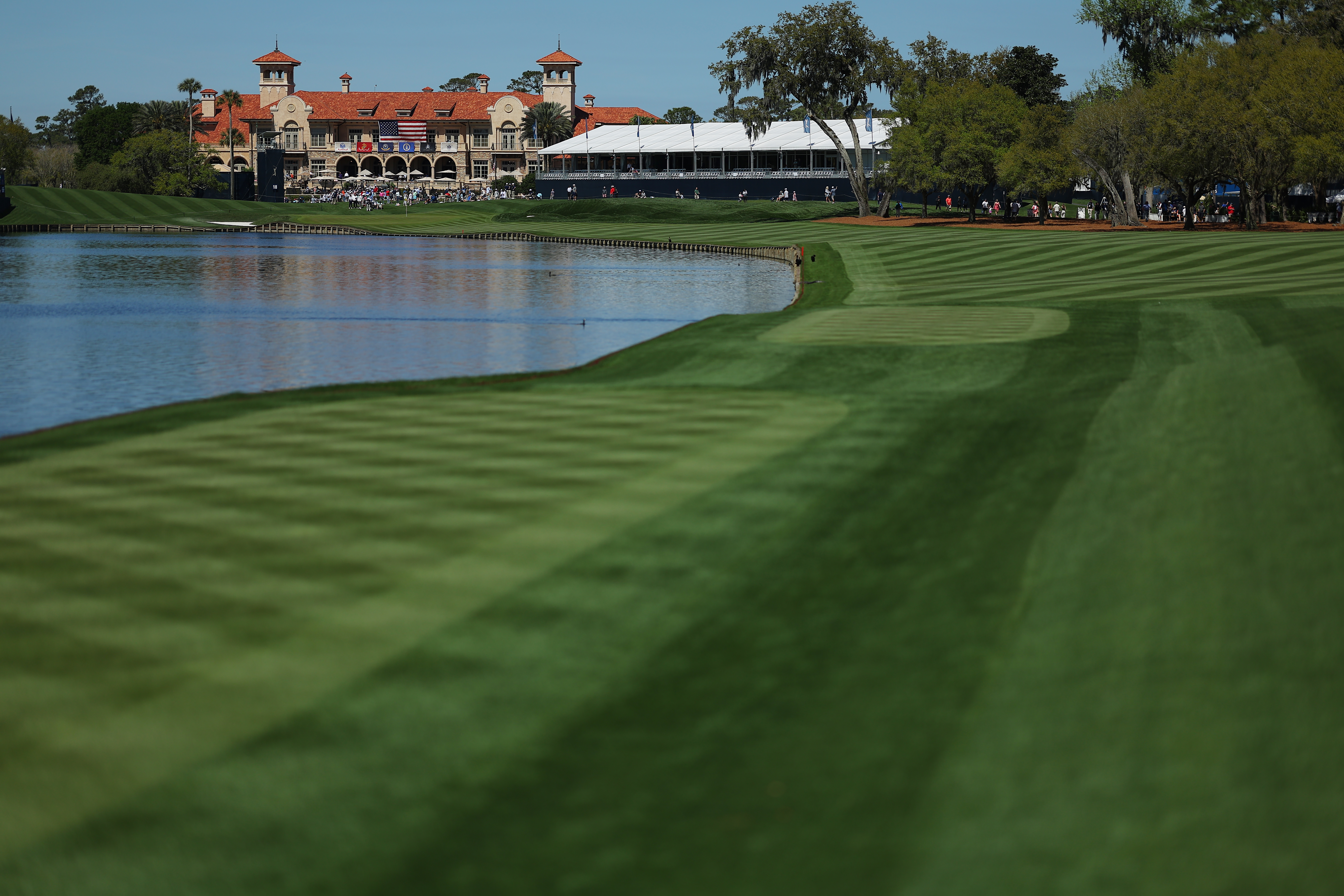 PONTE VEDRA BEACH, FLORIDA - MARCH 12: A general view of the clubhouse down the 18th hole during a practice round prior to THE PLAYERS Championship on the Stadium Course at TPC Sawgrass on March 12, 2024 in Ponte Vedra Beach, Florida. (Photo by Kevin C. Cox/Getty Images)