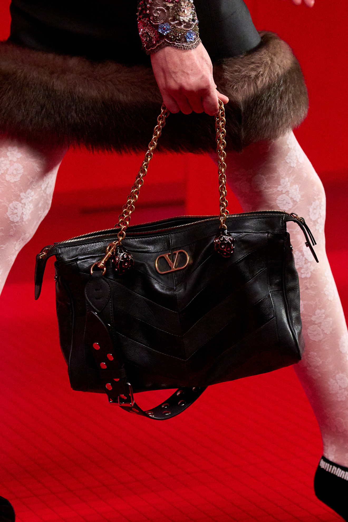 A model carried Anne Hathaway's Valentino Panthea Bag on the Fall 2025 runway.
