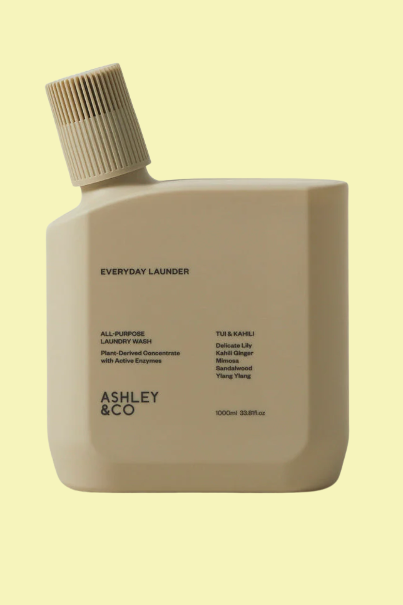 A sand-colored bottle of laundry detergent against a light yellow background