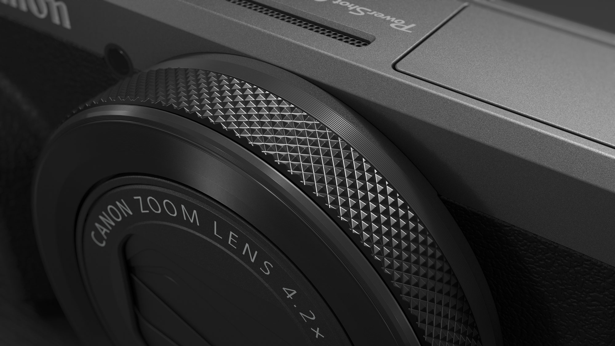 Close up of the Canon PowerShot G7 X Mark III Anniversary Edition in graphite, on a graphite-type surface