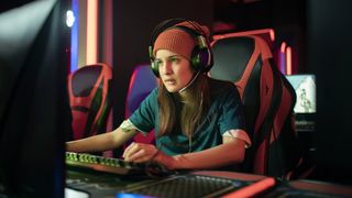 Girl wearing a beanie using a gaming headset