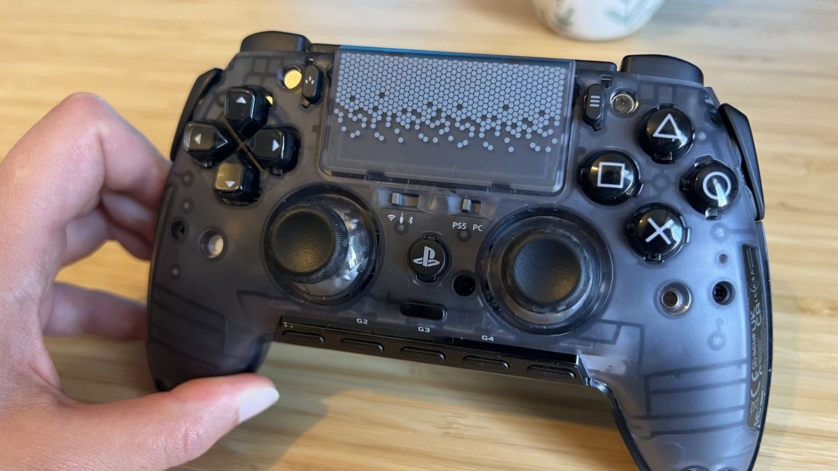 Scuf Omega PS5 controller without top plate on a wooden desk