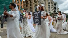 Activists, including child marriage survivors, campaign against child marriage at a march in Boston, Massachusetts in 2021