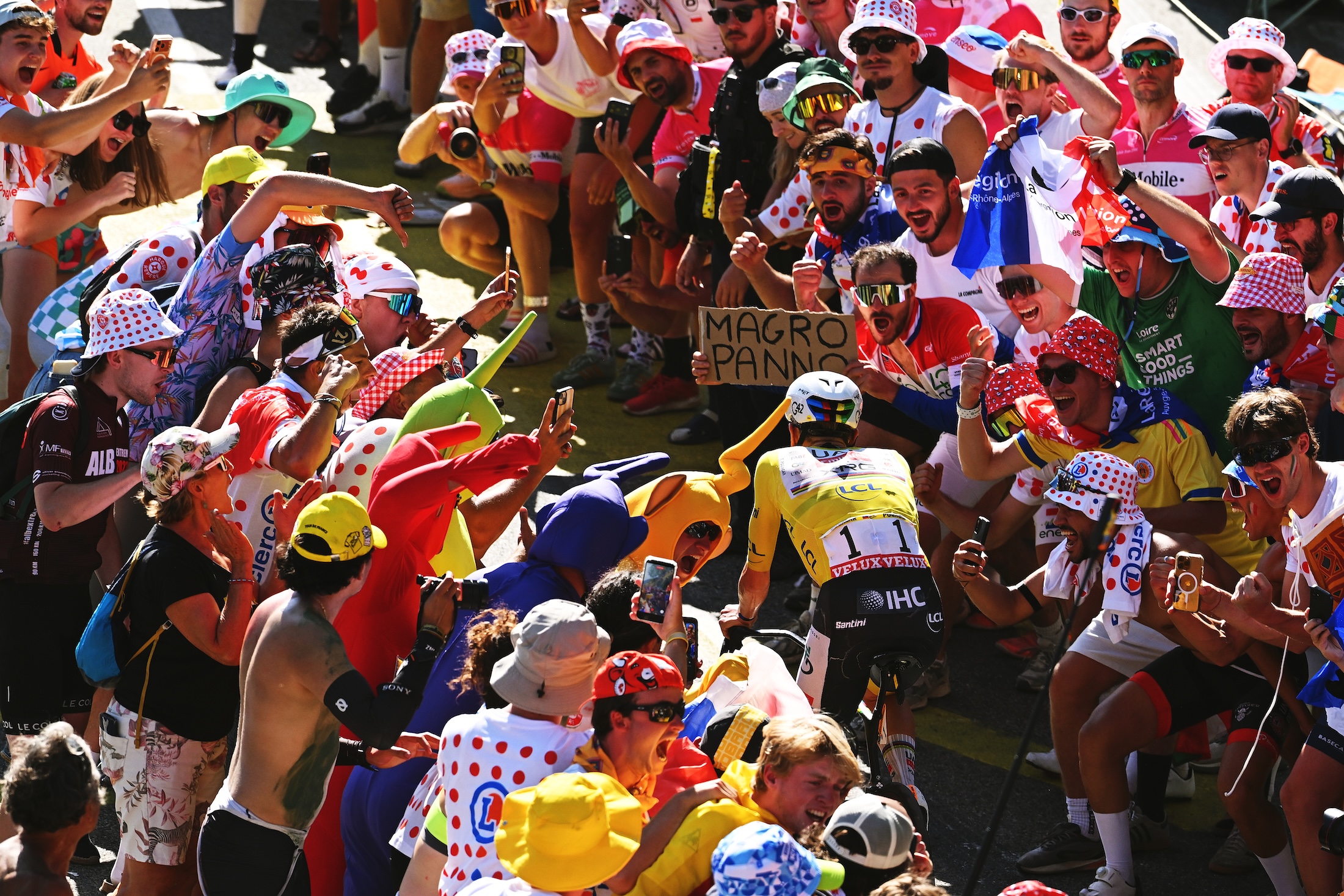 Tadej Pogacar of Slovenia and UAE Team Emirates - XRG - Yellow Leader Jersey competes climbing to the Alpe d'Huez (1835m) while fans cheers during the 113th Tour de France 2026, Stage 19