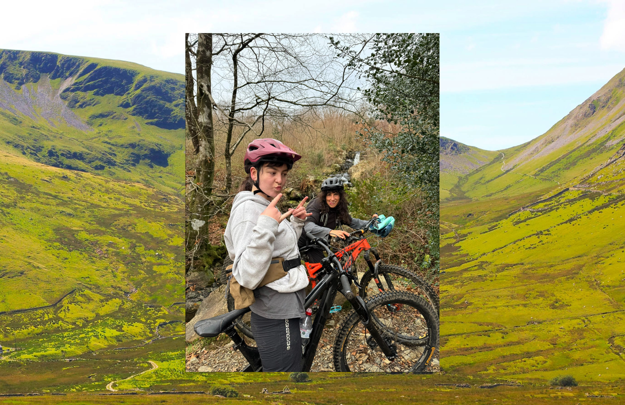 Mountains with a photo over the top of two women on bikes