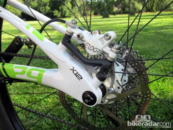 The rear end of the Scalpel 29'er Carbon 2 uses a standard brake caliper but a proprietary adapter. A 142x12mm thru-axle setup helps keep things tied together but you'll need an Allen wrench to remove the rear wheel unless you swap in a different axle.