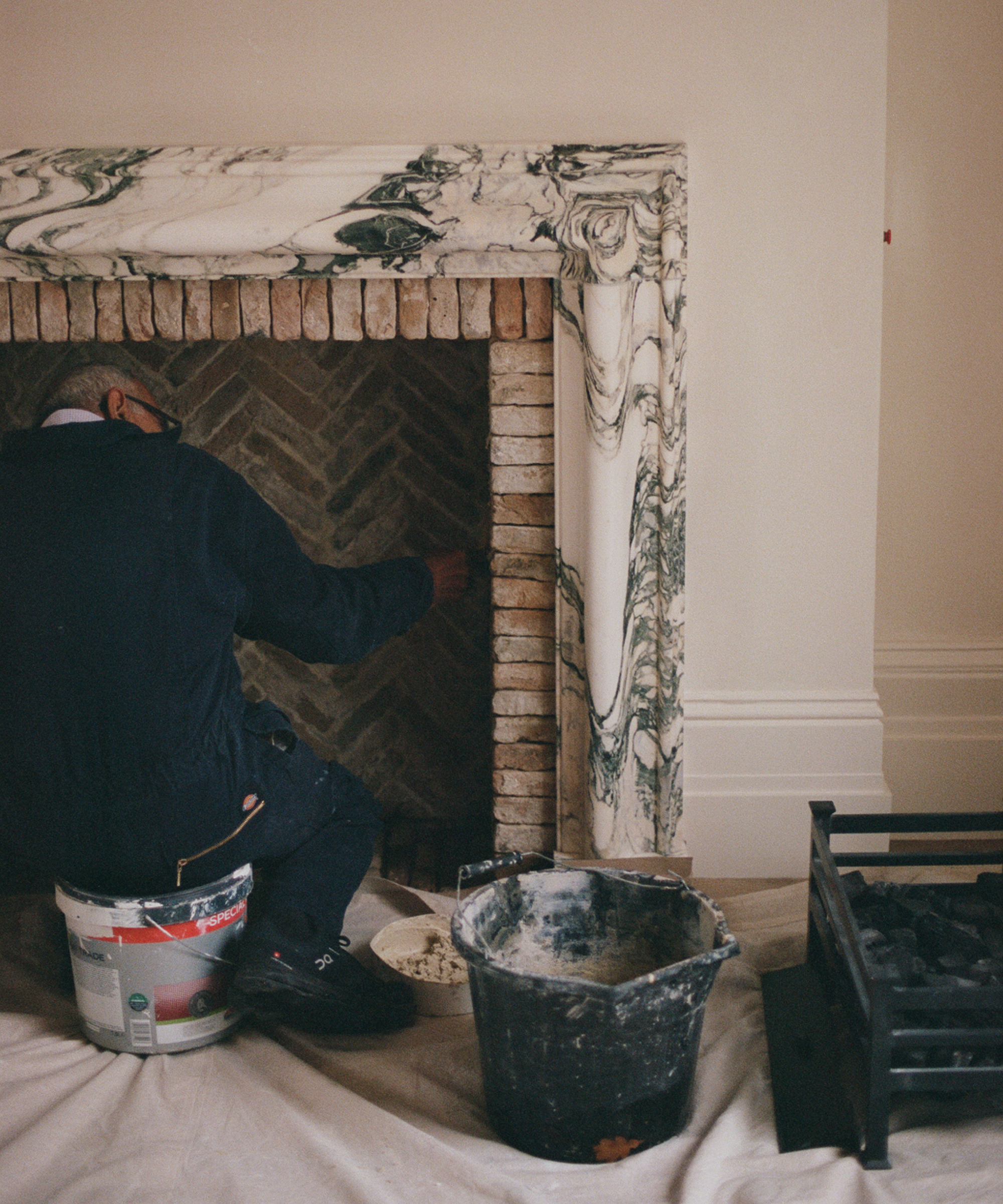 marble fireplace being tiled on location