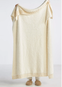9. Anthropologie Crocheted Eyelash Wildflower Throw Blanket | Was $128