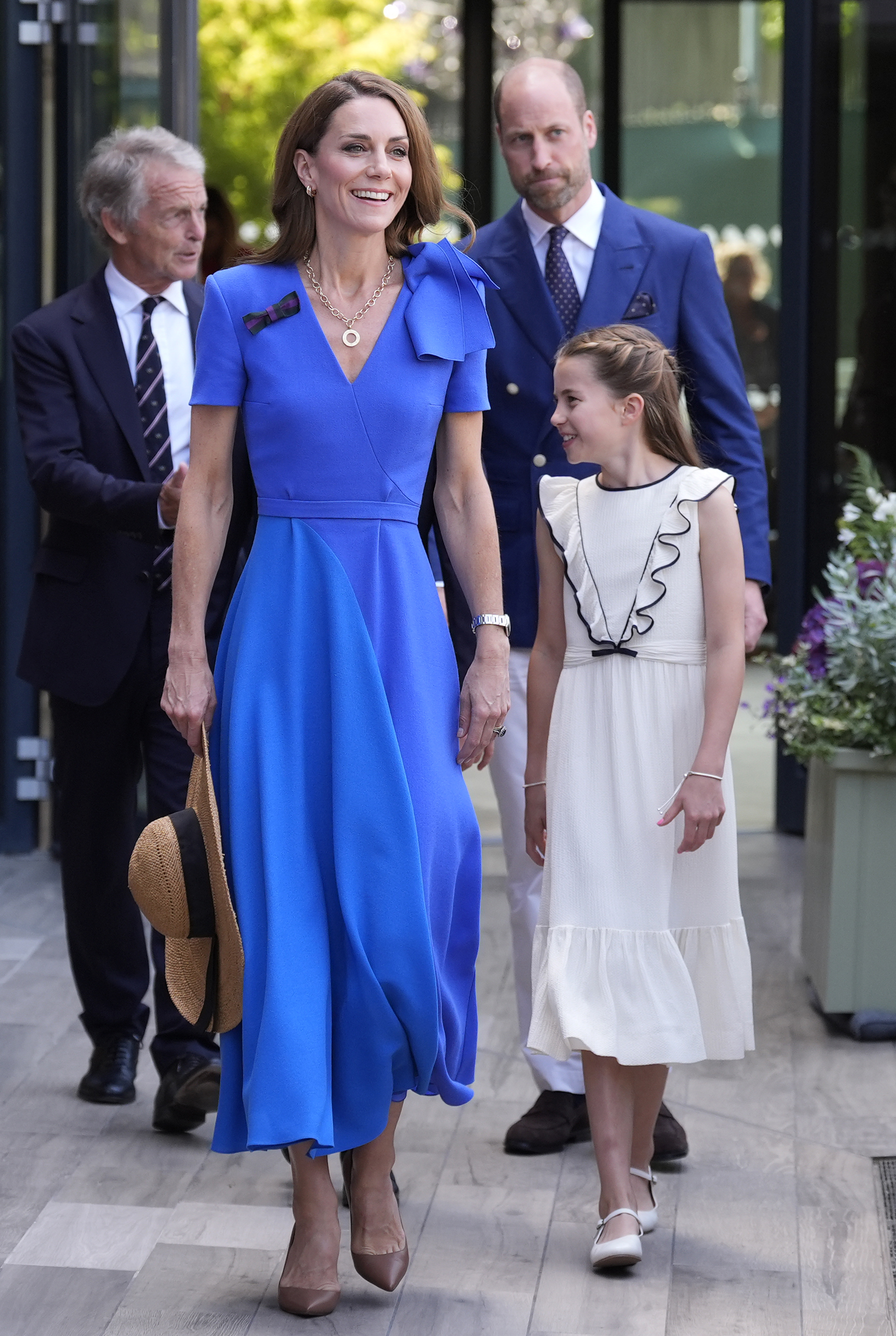 Princess Kate, Princess Charlotte and Prince William walking at Wimbledon 2025