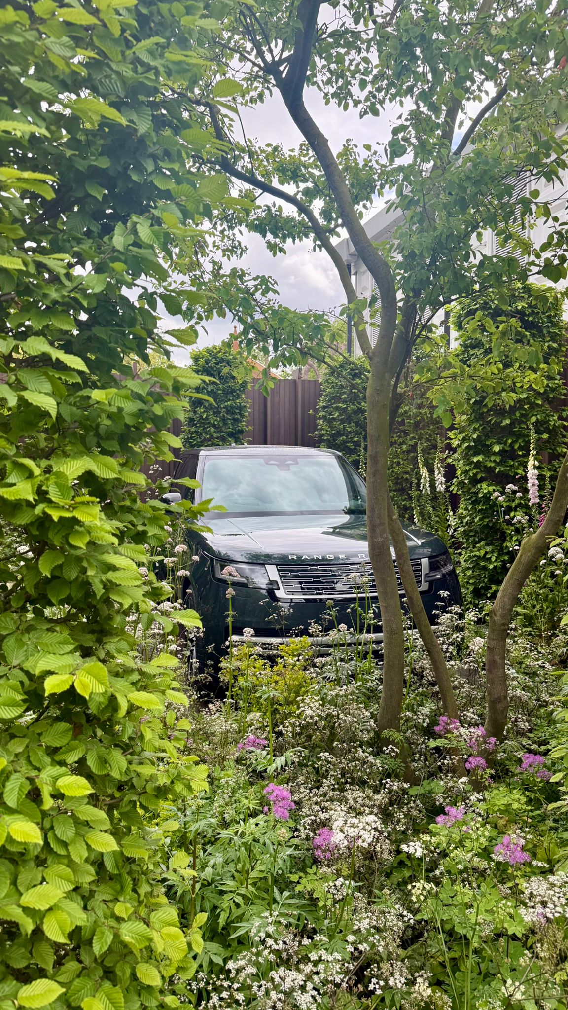 A Ranger Rover in a flowerbed