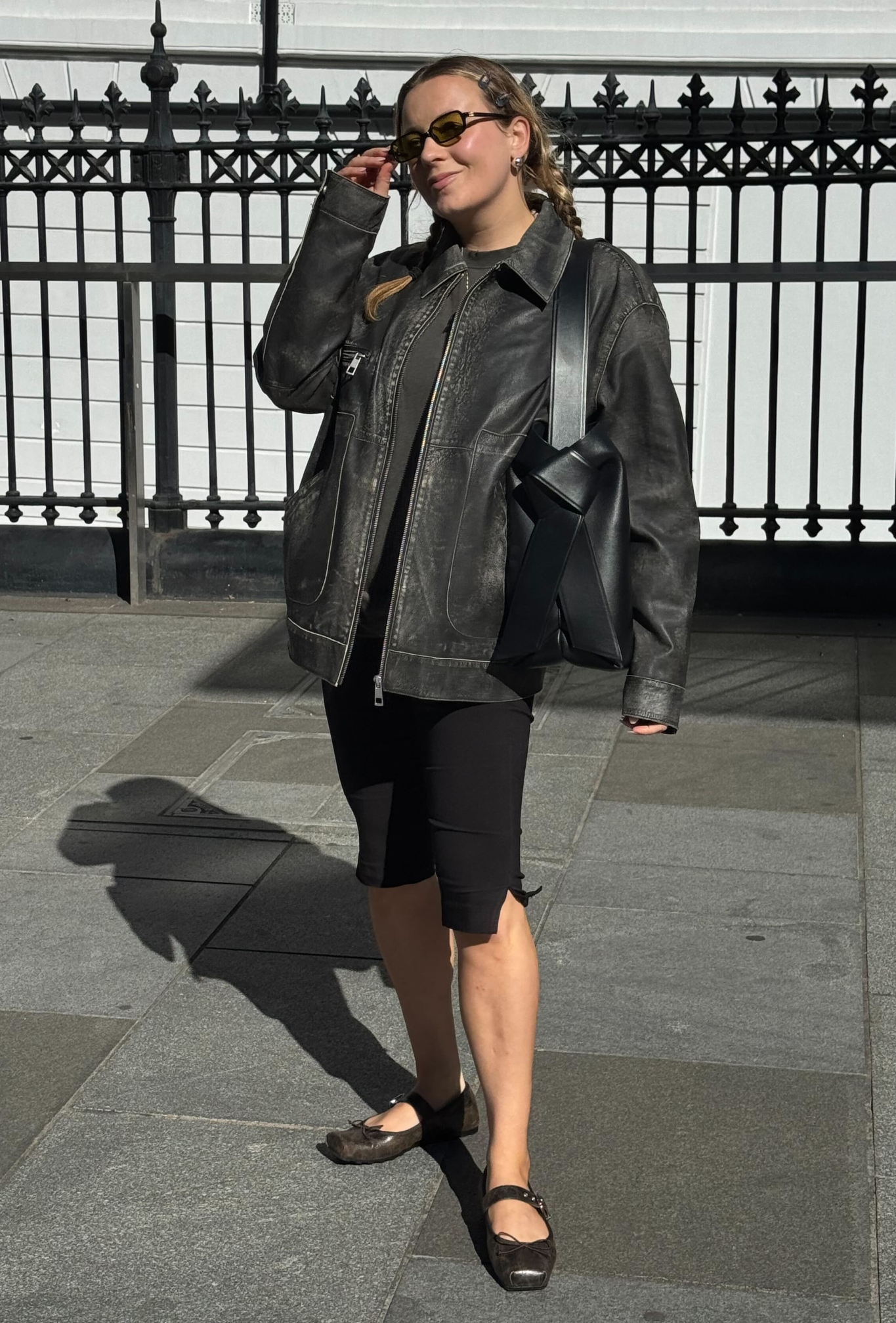 @rebeccarhysevans wearing a leather jacket outfit.