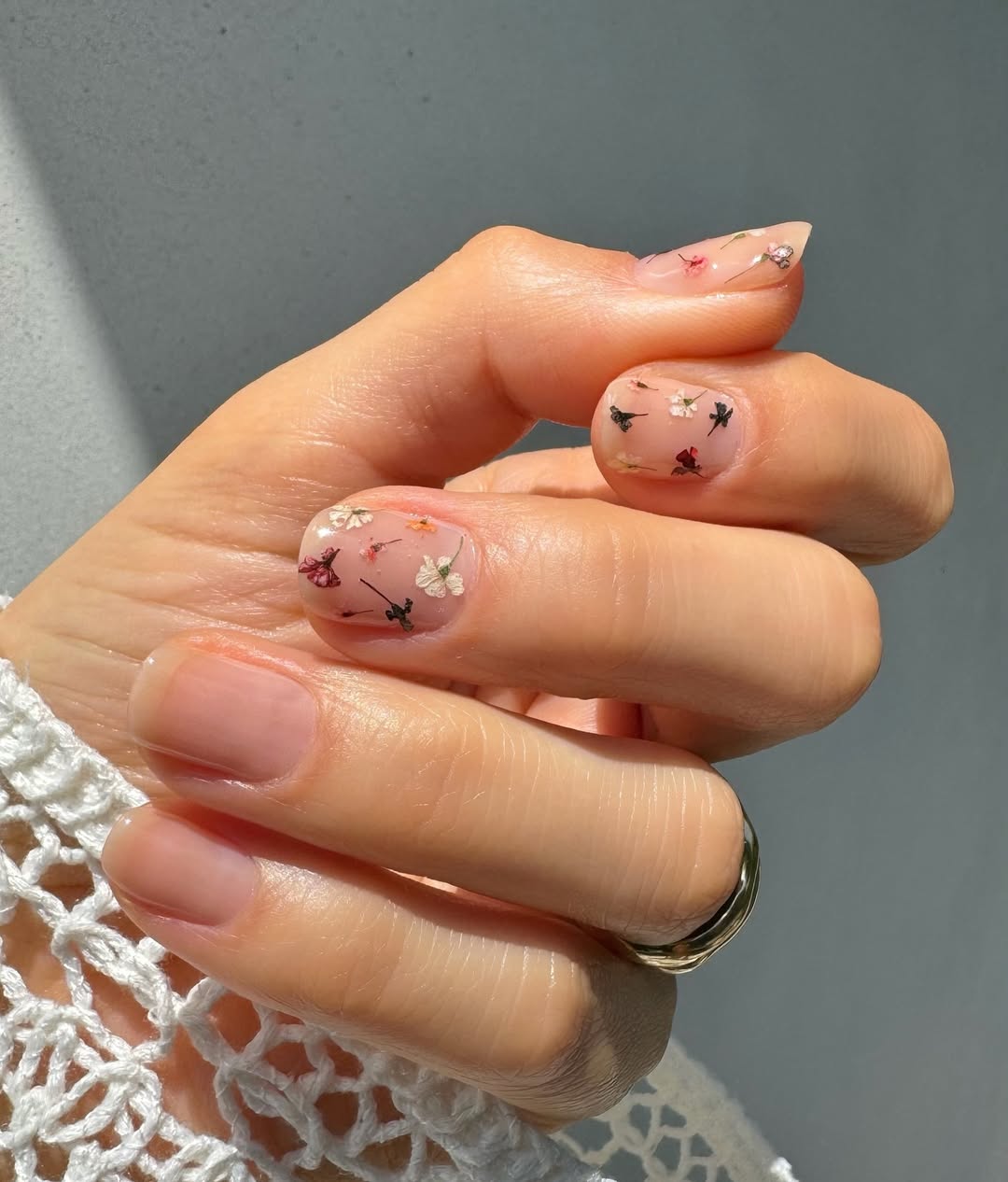 Betina Goldstein with floral milk nails