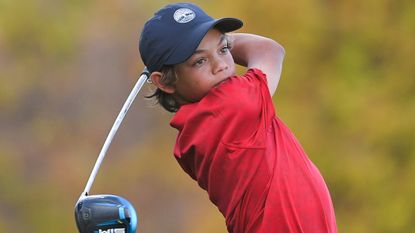 Charlie Woods tees off on the 18th hole at the 2021 PNC Championship