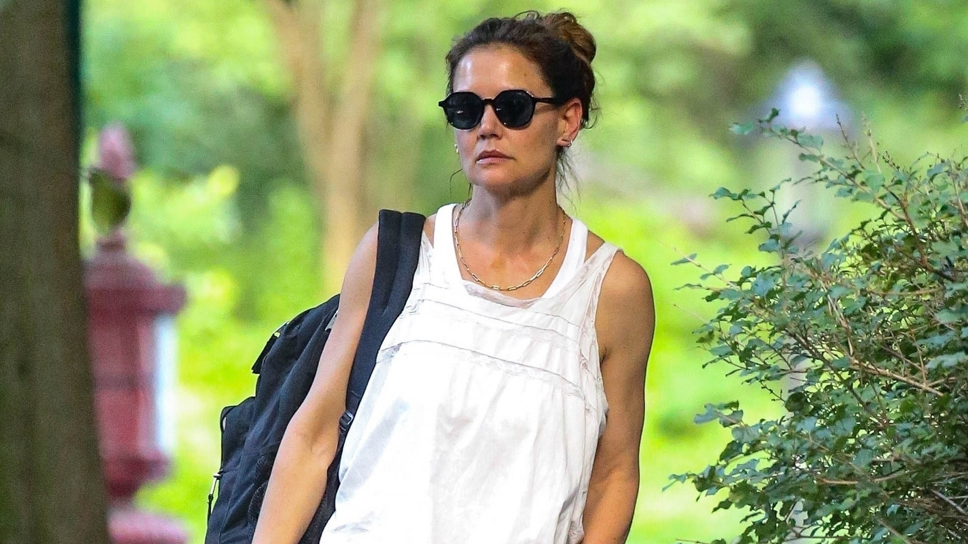Katie Holmes wore khaki pants and a babydoll dress as a shirt in NYC