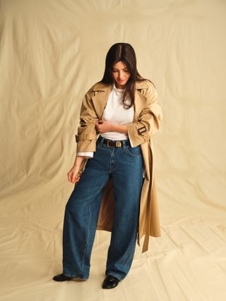 woman in trench and jeans