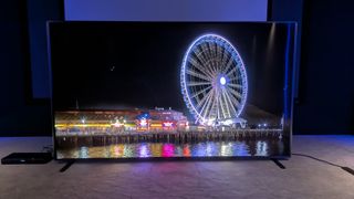 Hisense 110UXN with ferris wheel at night on screen