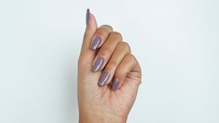 A hand with grey nails
