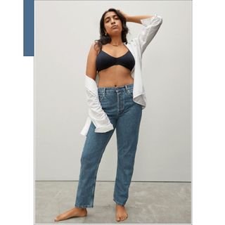 Everlane The 90s Cheeky Straight Jean, modeled by a woman, one of the best sustainable jeans in our round-up