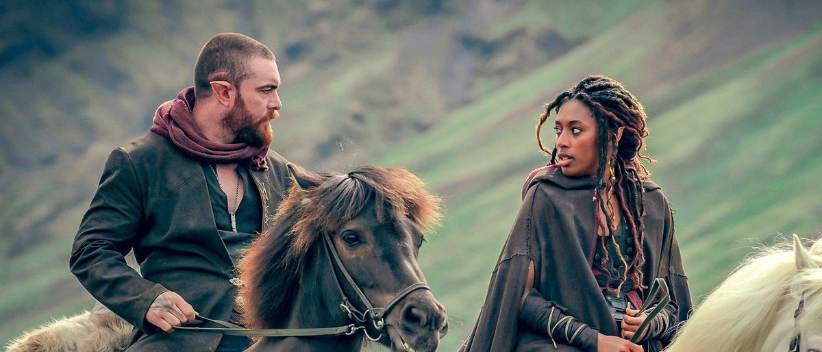 (L to R) Laurence O&#039;Fuarain as Fjall and Sophia Brown as Éile on horseback in The Witcher: Blood Origin