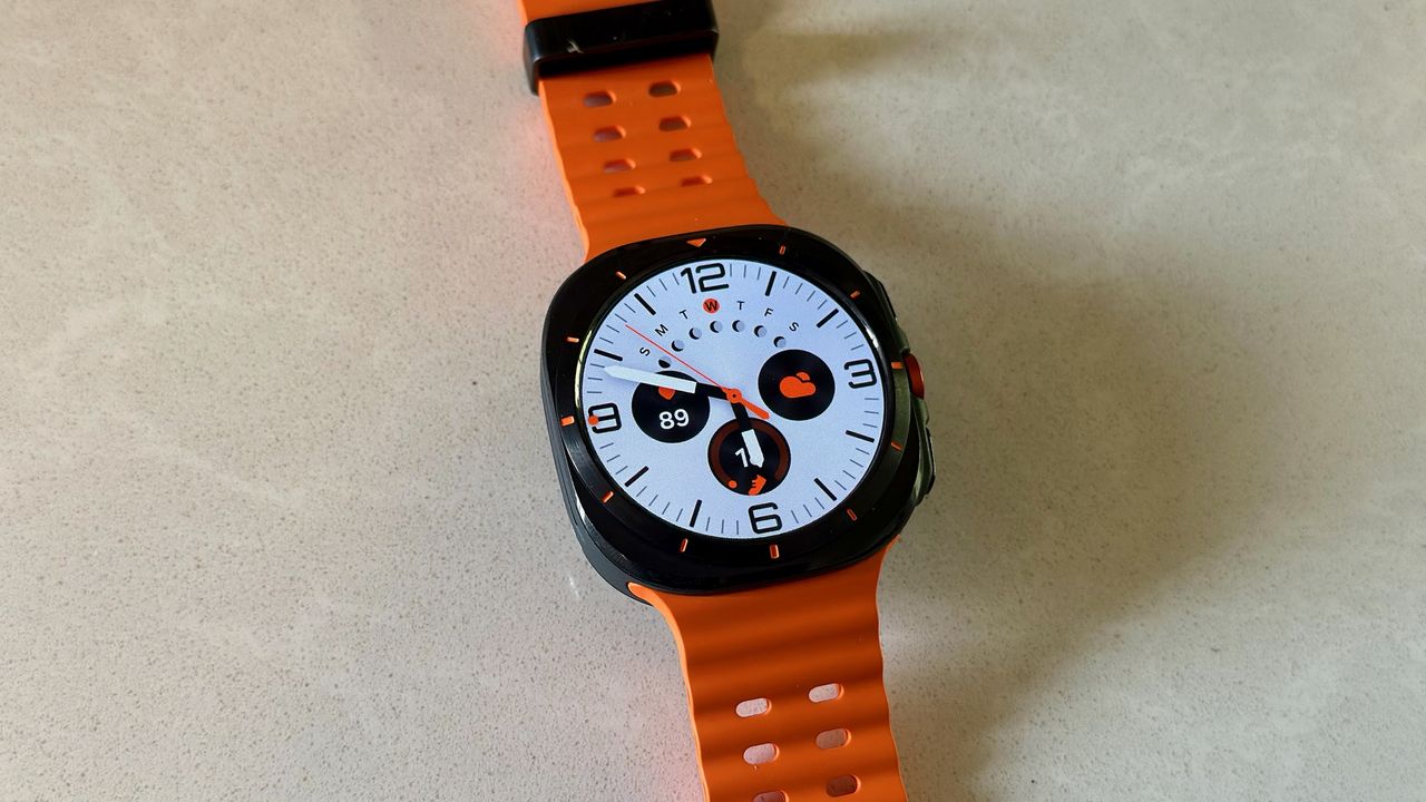 The Samsung Galaxy Watch Ultra sitting on a white counter, showing the Simple Ultra watch face.