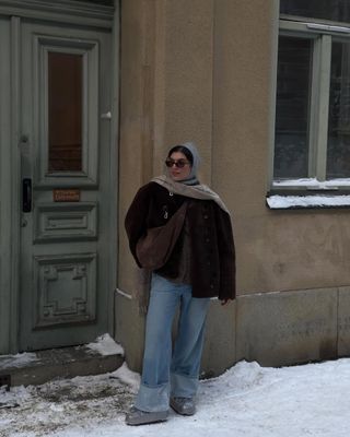 winter snow day outfits: scarf, balaclava, snow boots and wide-leg jeans