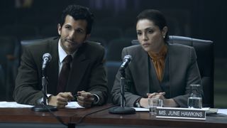 Gabriel Sloyer as Diaz and Juliana Aidén Martinez as June at a hearing in Griselda episode 5