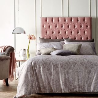 bedroom with headboard and blush pink