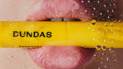 Dundas lip balm in a mouth
