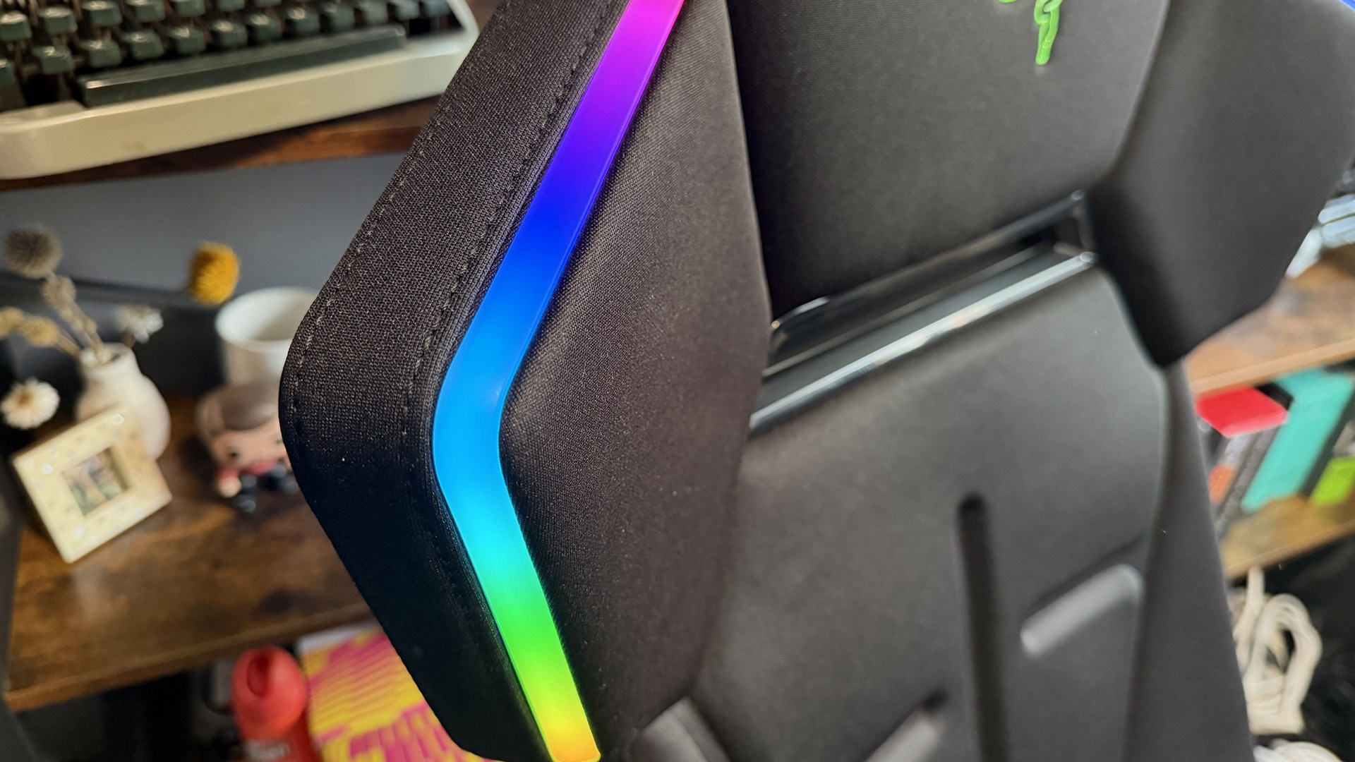 The Razer Soma Chroma gaming chair set up in front of a desk.