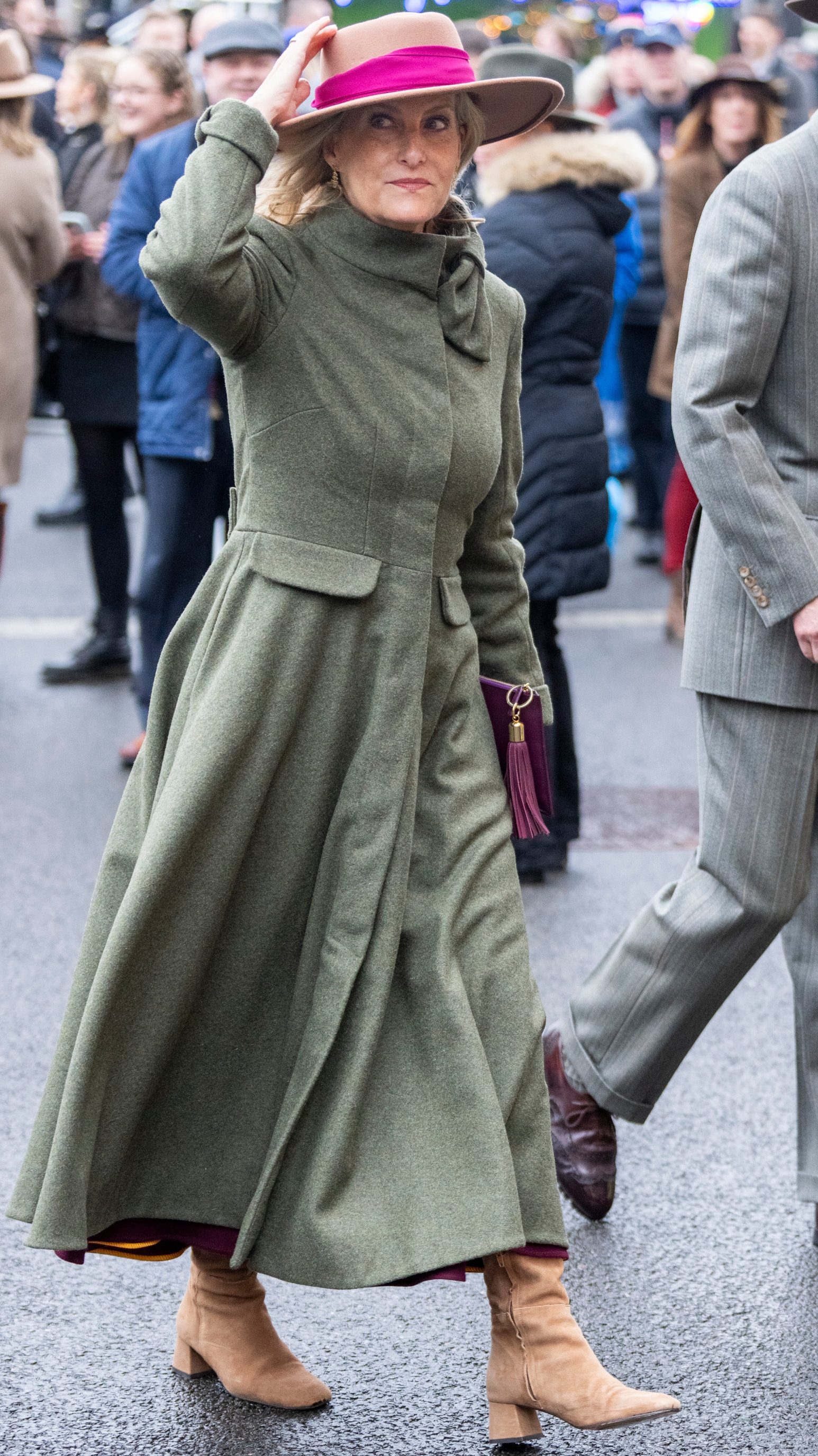 Sophie, Duchess of Edinburgh holds her hat as she attends The Coral Gold Cup at Newbury Racecourse on November 29, 2025
