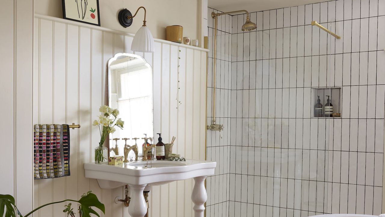 Bathroom with white tiles in shower